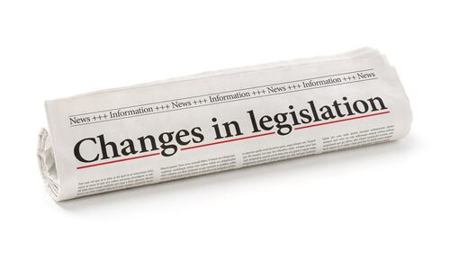rolled up newspaper with headline: "Changes in legislation"