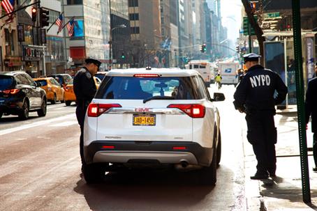 Police pulling over a driver in NY